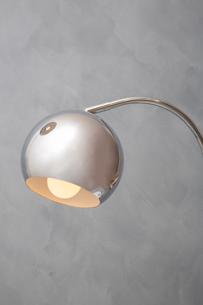 Orsina Table Lamp with a sleek silver dome shade and elegant curved design for modern decor