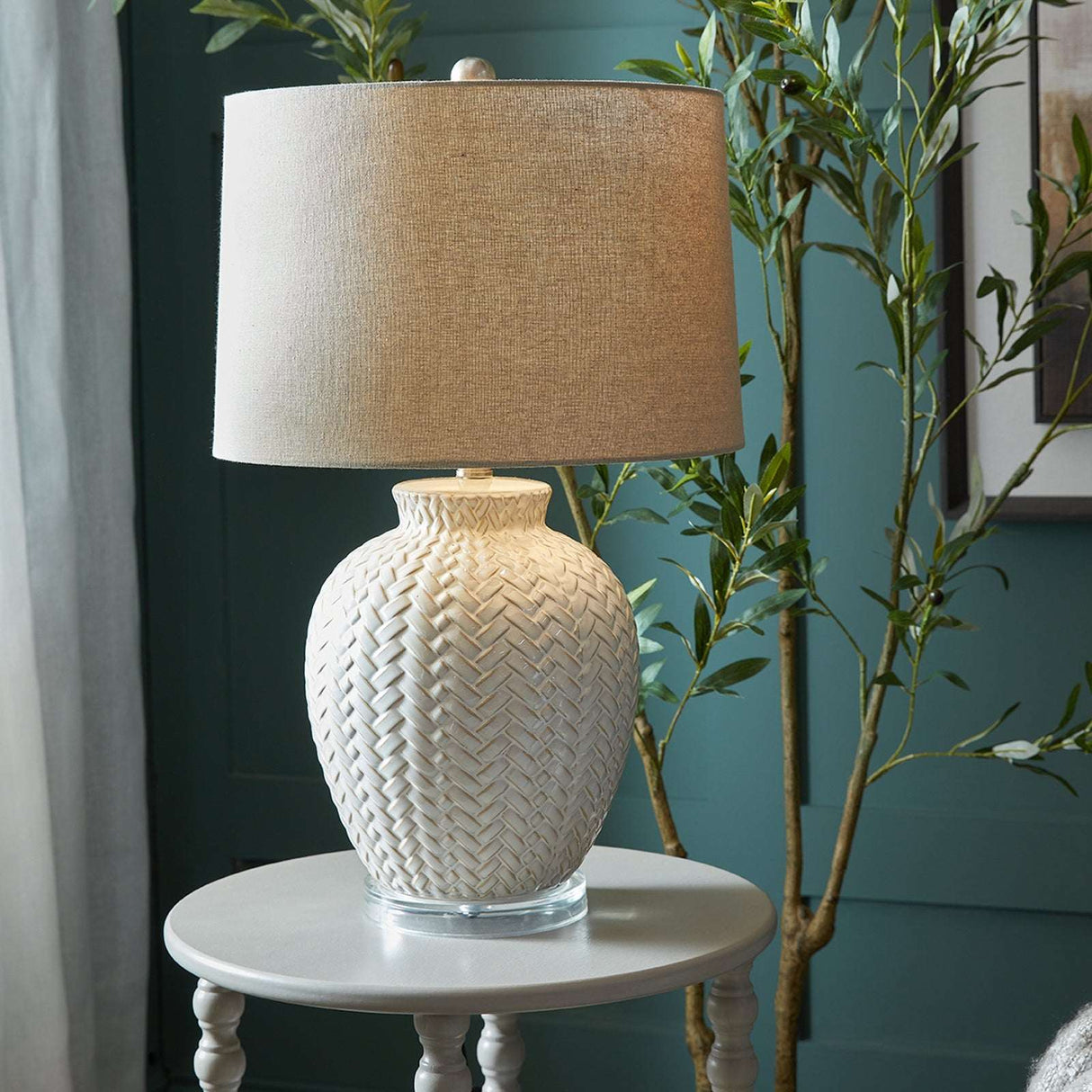 Ceramic Table Lamp with a textured base and a natural fabric shade, ideal for modern home decor