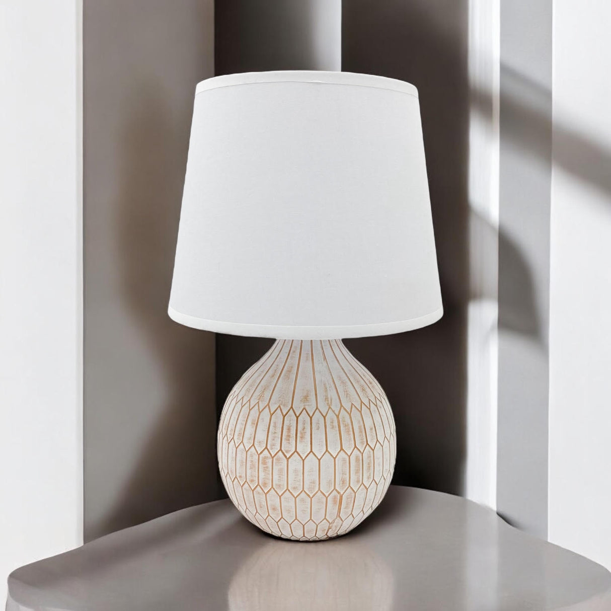 Elegant MSL Table Lamp with a textured base and white shade, perfect for modern interiors