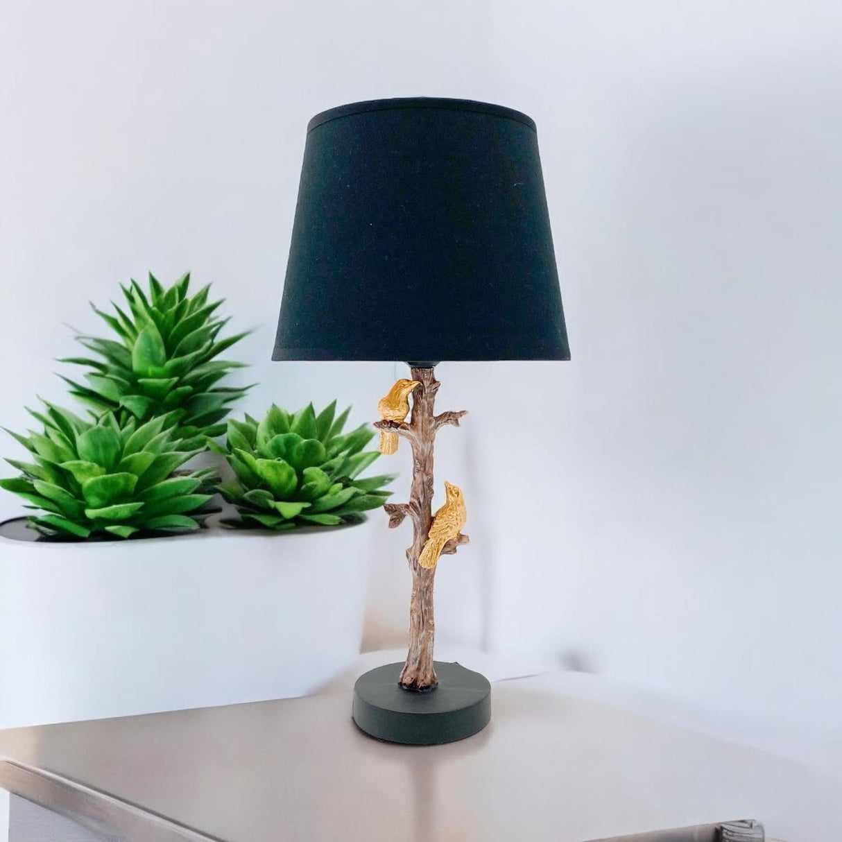 Unique Table Lamp with a tree branch design and black shade, featuring decorative squirrels