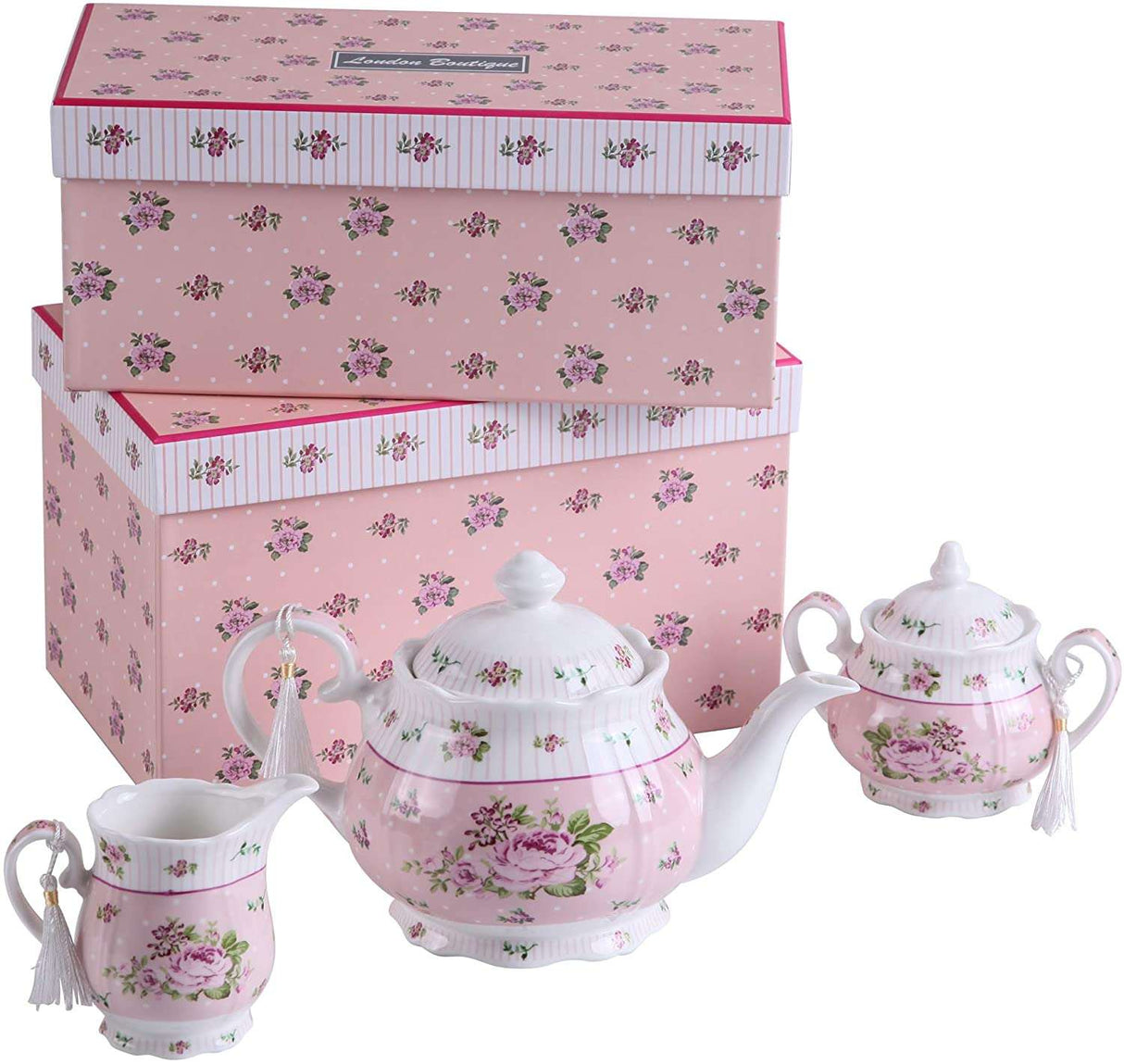 Pink floral tea set with a cake stand, including teapot, sugar bowl, and creamer for elegant dining