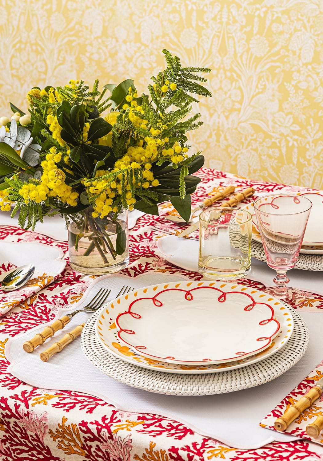 Casa by Josephine Jenno Lunch Plate decorated with red scallop design on a patterned dining table setting