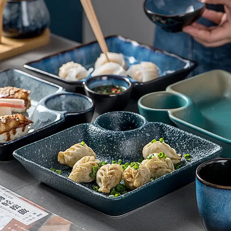 Nisu Home serving plates with compartments for dumplings and sauce, designed for elegant dining