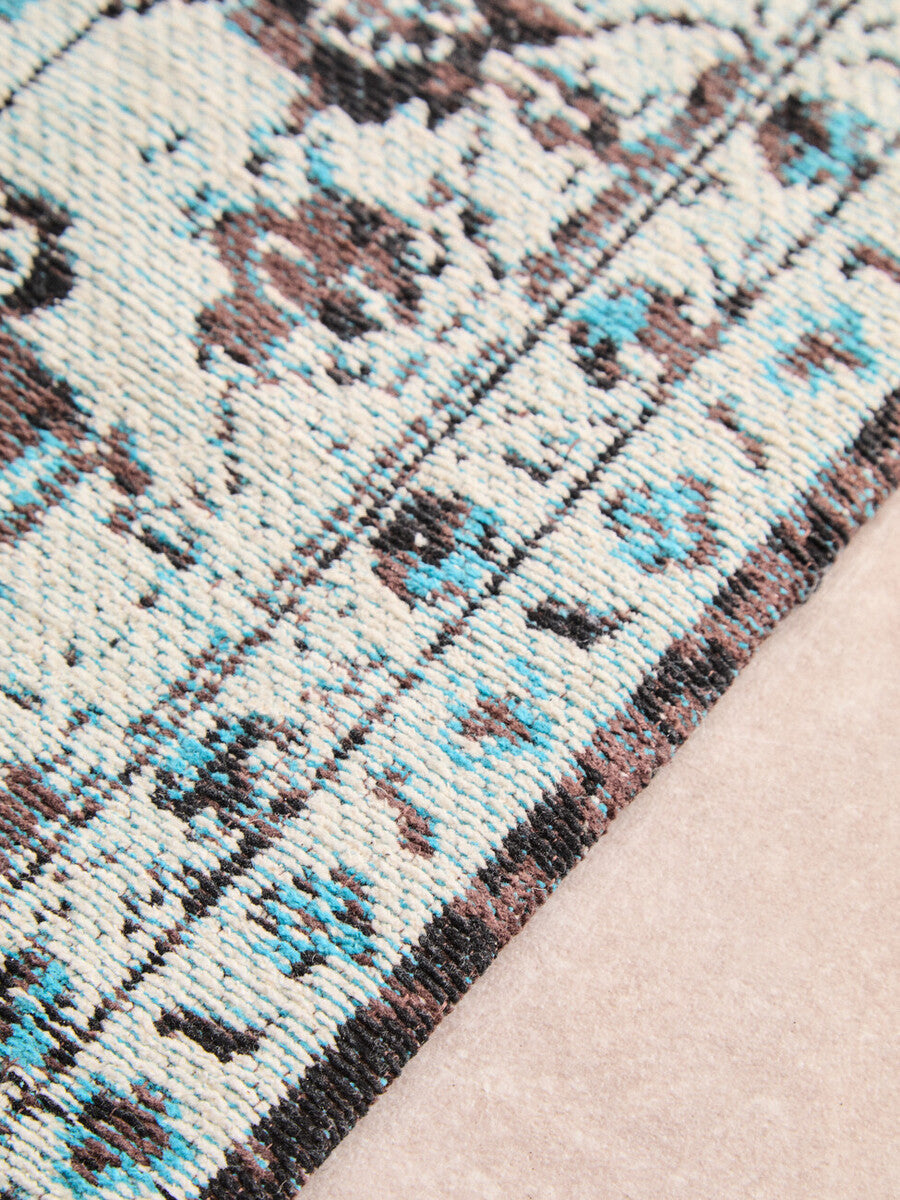 Orsina Teal Rug featuring intricate patterns and a plush texture for stylish home decor
