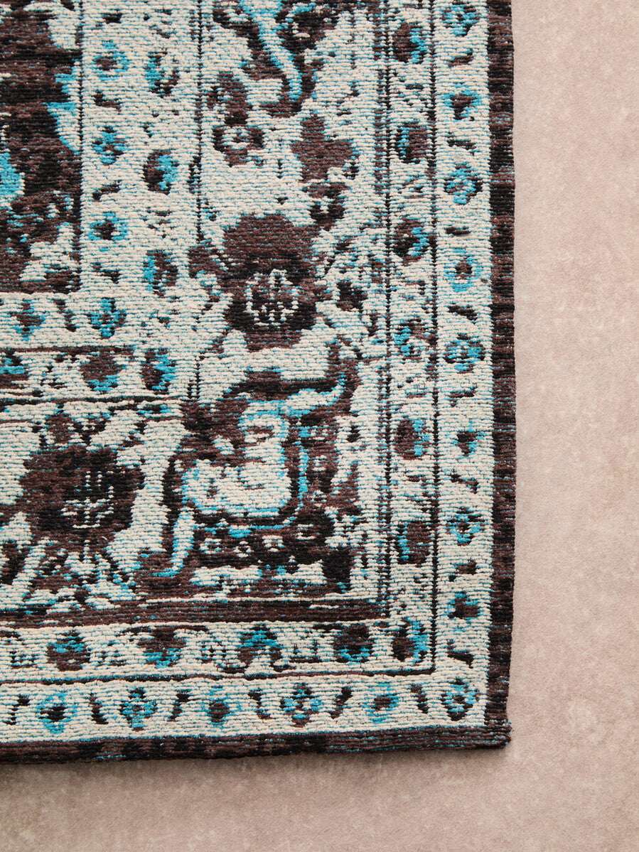 Orsina Teal Rug with intricate floral patterns and a modern design for stylish home decor