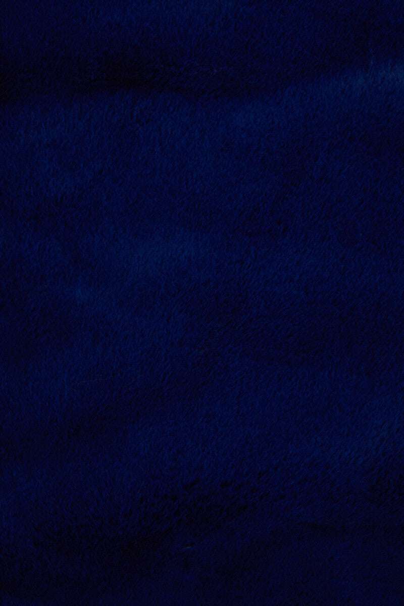 Orsina Fur Throw in deep navy blue for stylish warmth and comfort on chilly evenings