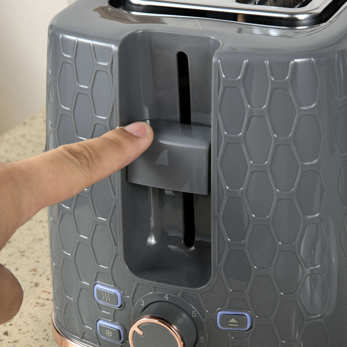 Close-up of Wise Galleria Toaster Set control panel with a finger adjusting settings