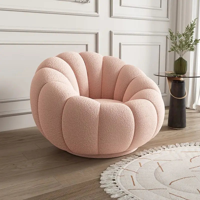 Nisu Home Plush Pink Chair with Curved Design for Comfortable Relaxation in Modern Interiors