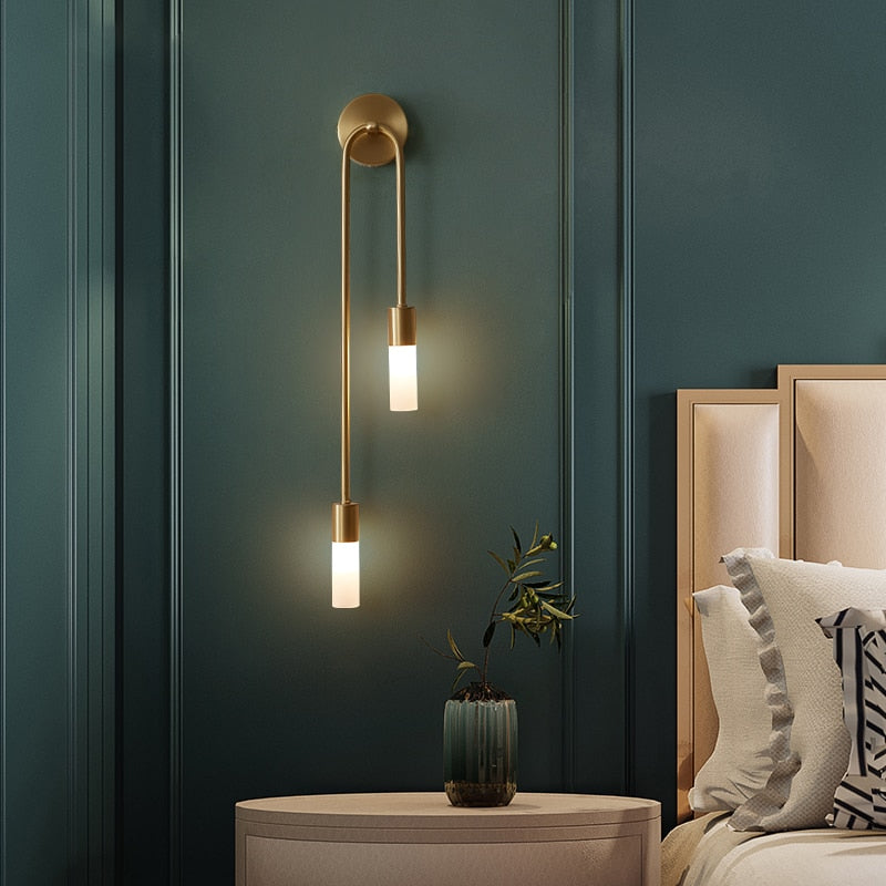 Stylish gold wall light with glass bulb, perfect for modern home decor and ambient lighting