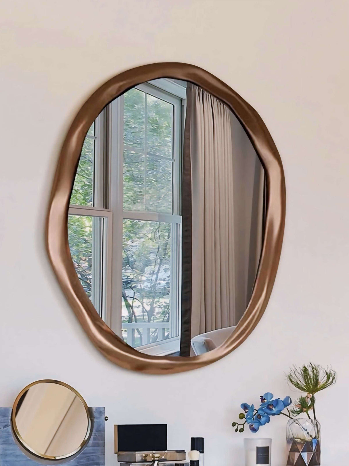 Stylish Nisu Home Wall Mirror with an Organic Shape and Elegant Bronze Finish