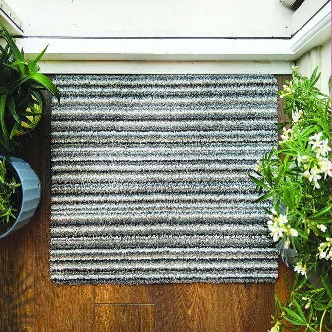 Stylish grey and white striped washable mat for entryways and indoor spaces