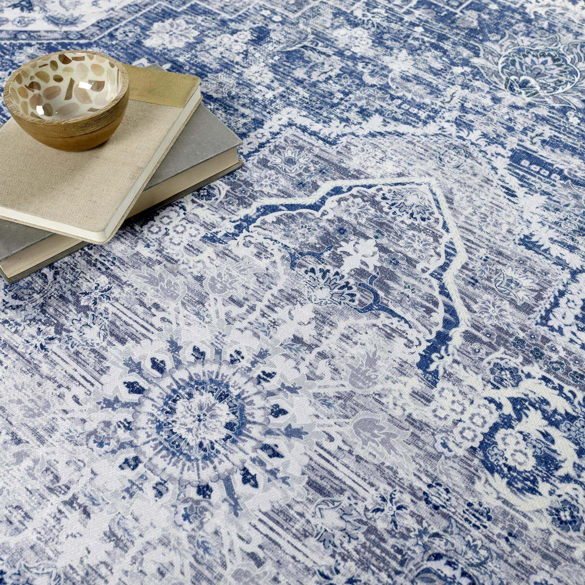 Stylish washable rug in blue and white patterns, perfect for modern home decor