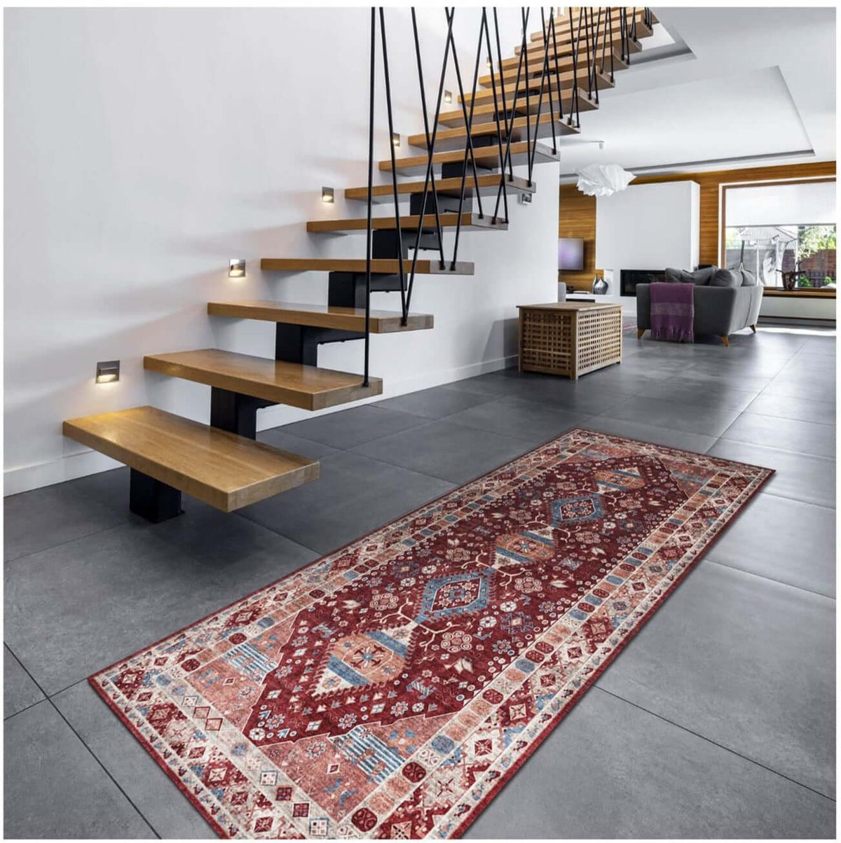 Traditional patterned washable rug placed beside modern stairs in a stylish living space