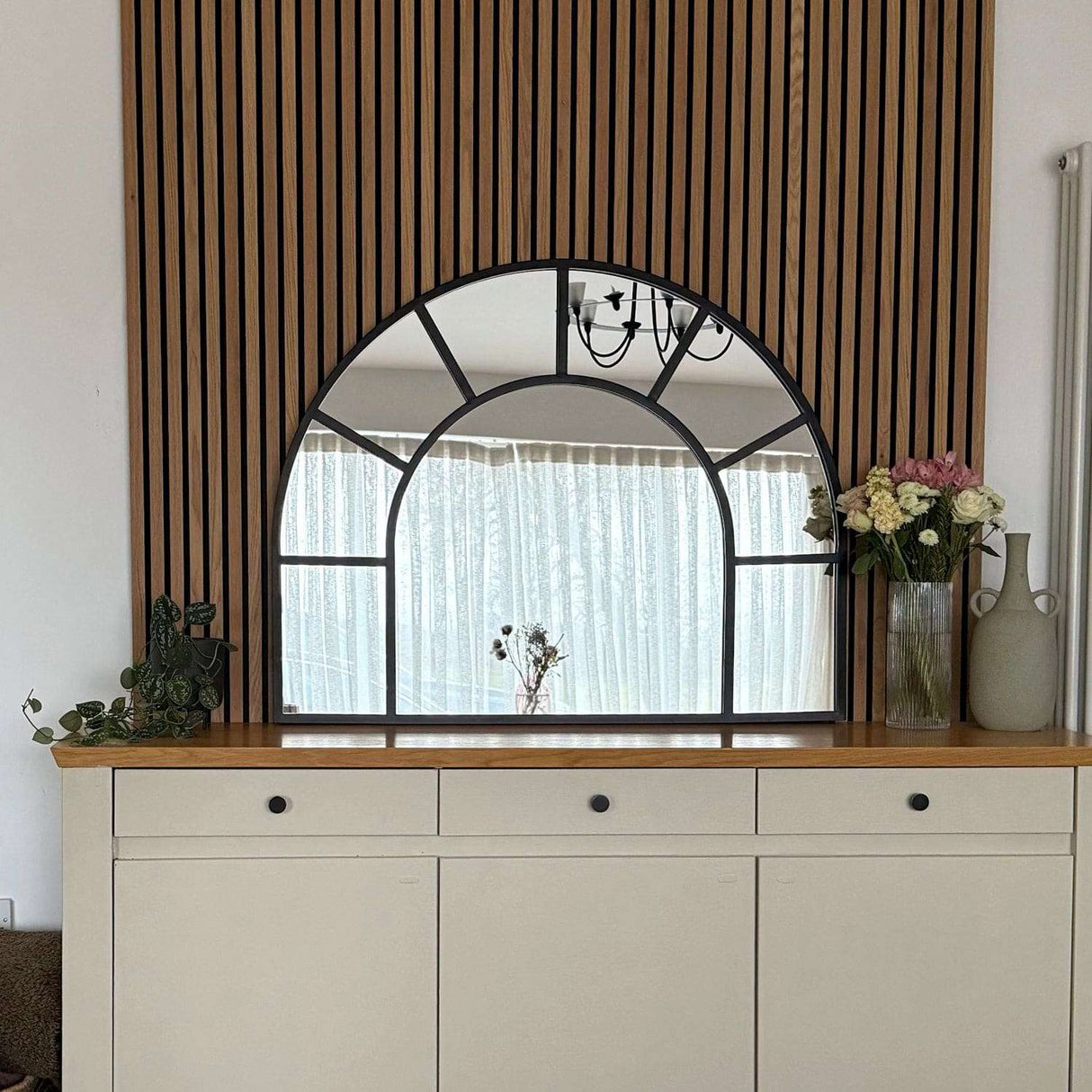 Jobu Home Window Mirror with an Elegant Arched Design Above a Stylish Sideboard