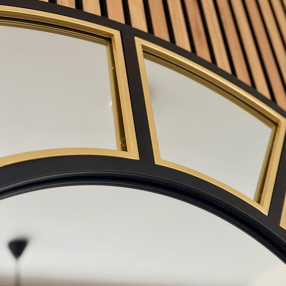 Jobu Home Window Mirror with a stylish gold and black frame, perfect for modern interiors