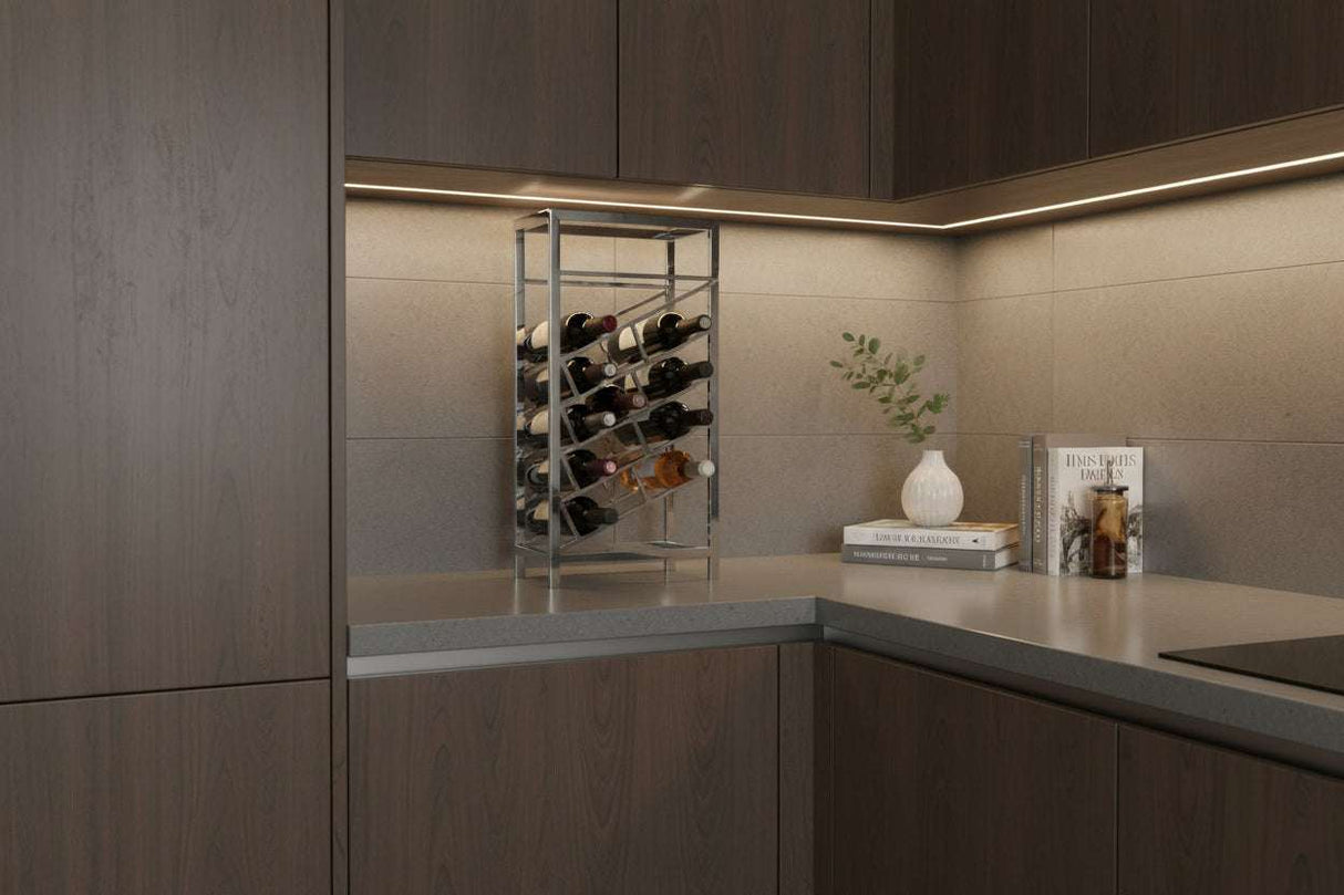 Orsina Wine Rack displayed in modern kitchen corner with glassware and decorative plants