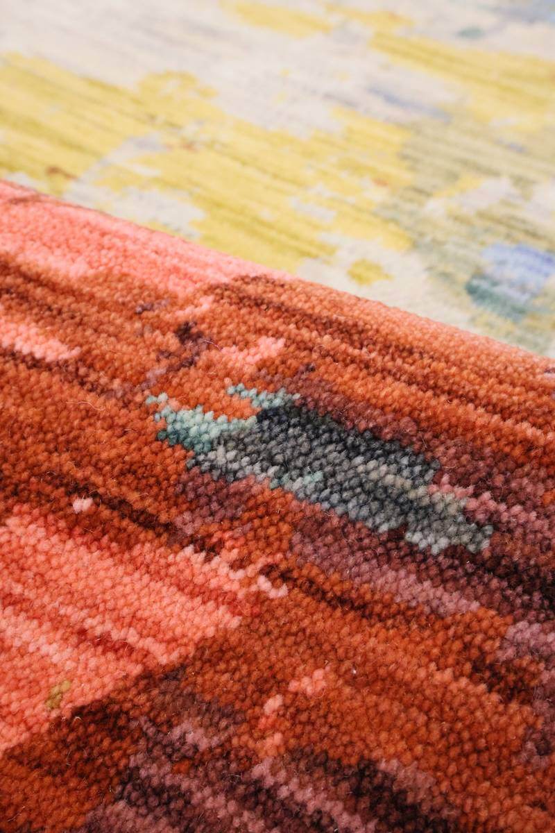 Close-up of a vibrant Wool Blend Rug featuring textured patterns and rich colours for stylish interiors
