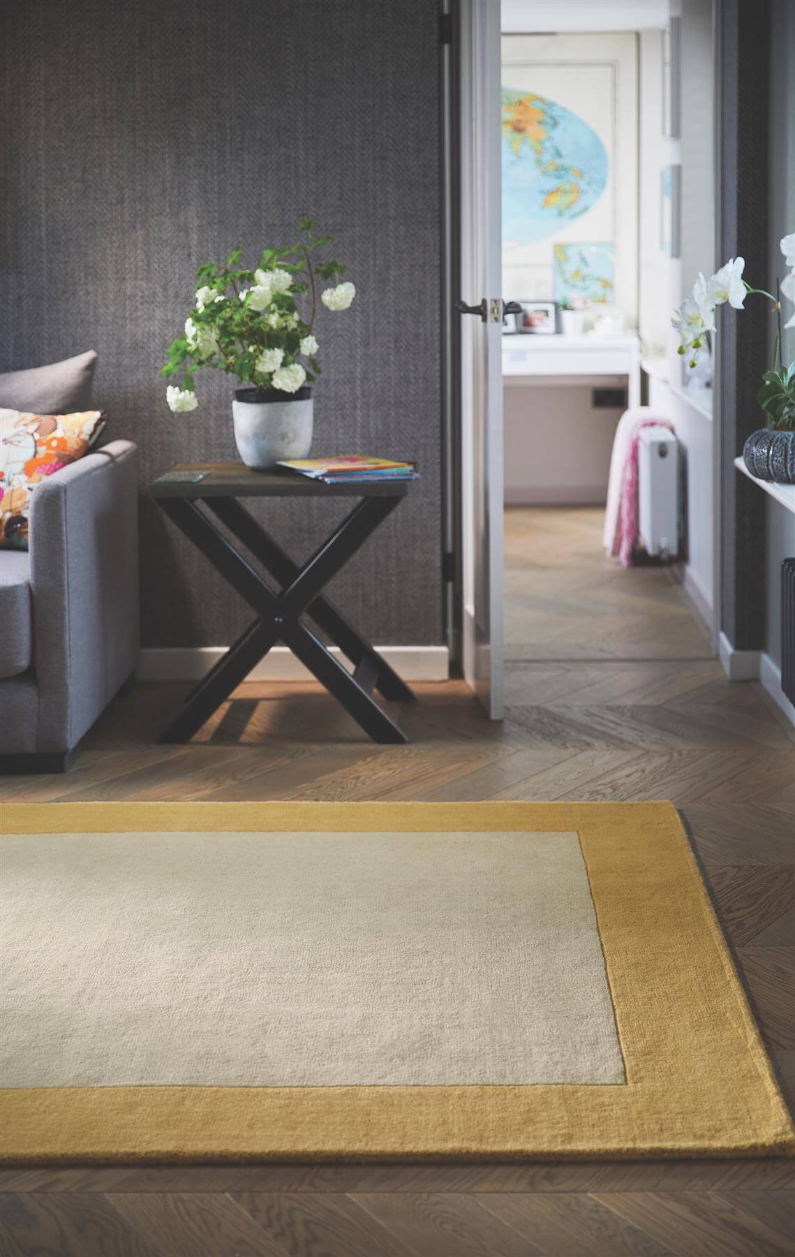 Stylish wool rug with a yellow border, perfect for enhancing modern living spaces