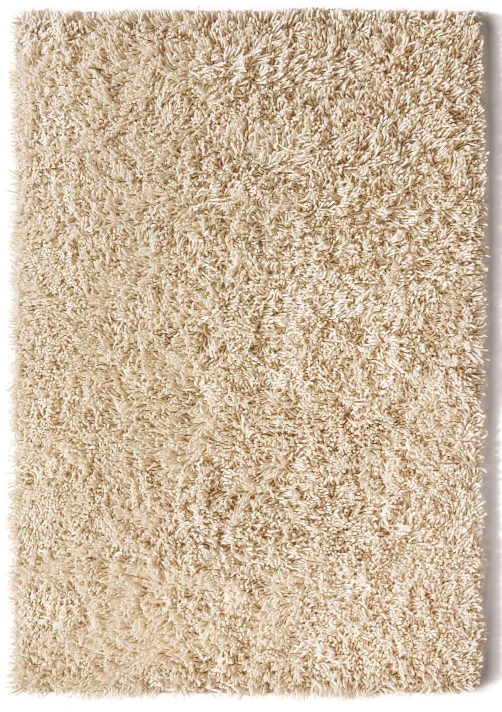Soft cream Wool Rug with a plush shag texture, perfect for adding warmth to any room