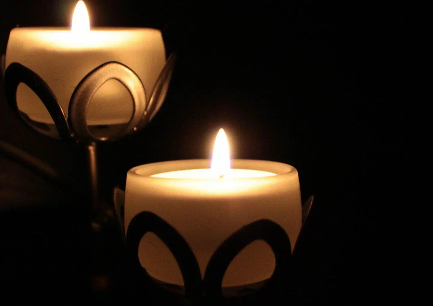 Elegant candles providing warm Hygge Lighting for a cosy and inviting atmosphere