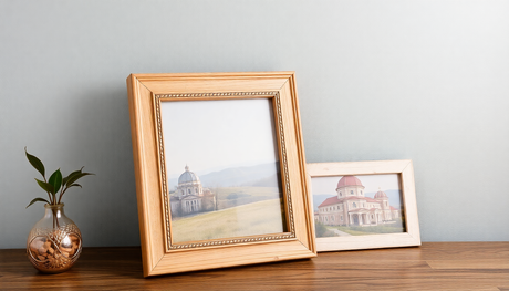 Elegant display of wooden photo frames on a stylish table with decorative plant