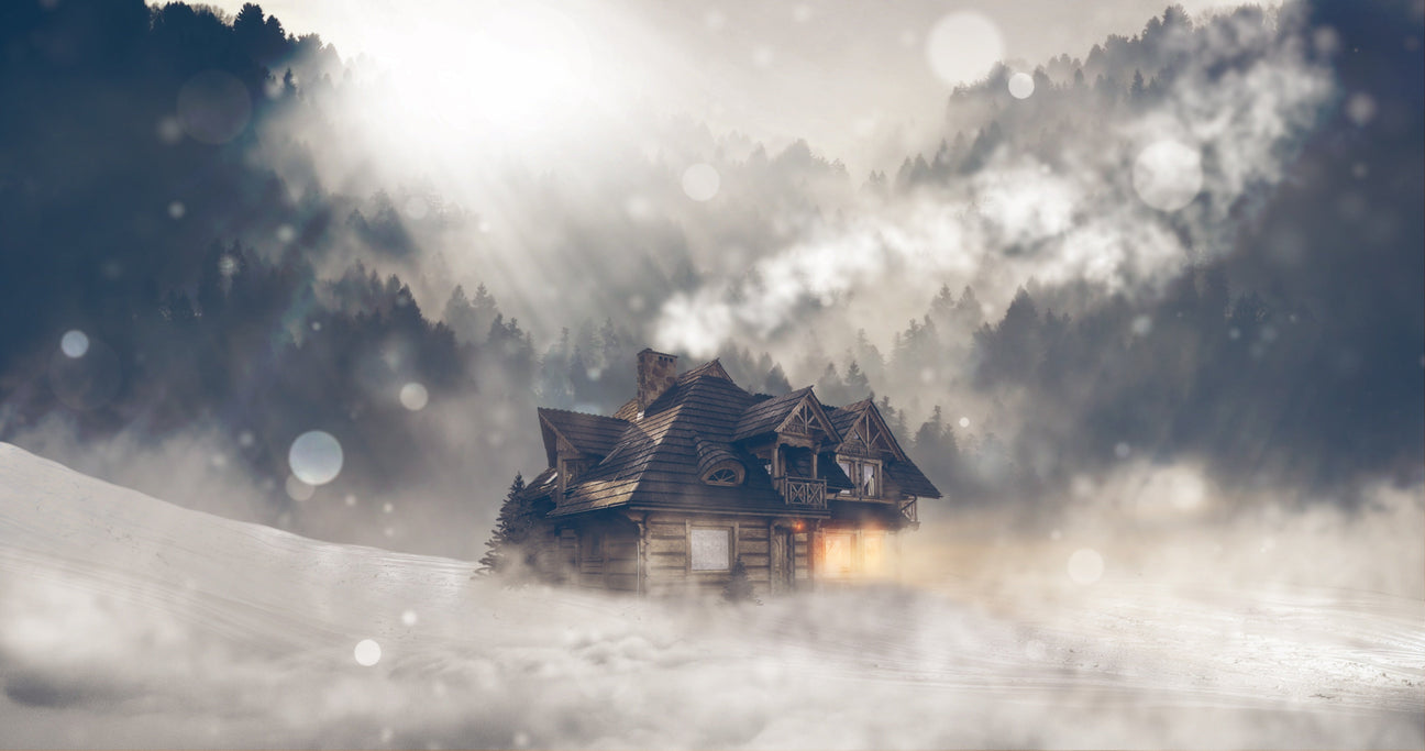 Charming winter home surrounded by snowy mountains, perfect for Winter Home Decor inspiration.