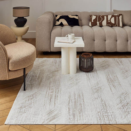 Elegant abstract rug placed under a modern coffee table in a stylish living room
