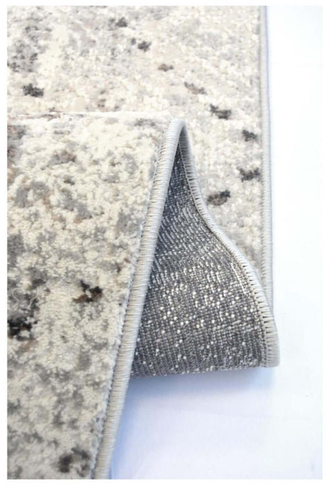 Close-up of a textured Abstract Rug with a soft grey backing for added comfort and durability