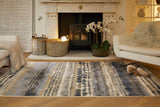 Stylish abstract rug in blue and beige tones, perfect for enhancing living room decor