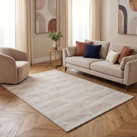 Abstract Rug in a light beige design, enhancing a modern living room with a sofa and stylish decor
