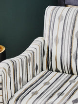 Orsina Accent Chair with a stylish striped pattern in neutral tones for modern interiors