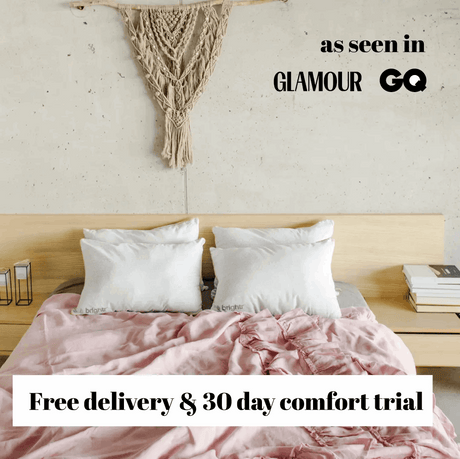 Brightr Sleep Adjustable Pillow Bundle on a stylish bed with a pink duvet for comfort and support.