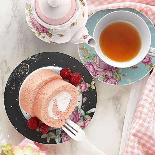 Elegant Afternoon Tea Plates featuring floral designs with a slice of pink roll cake and raspberries