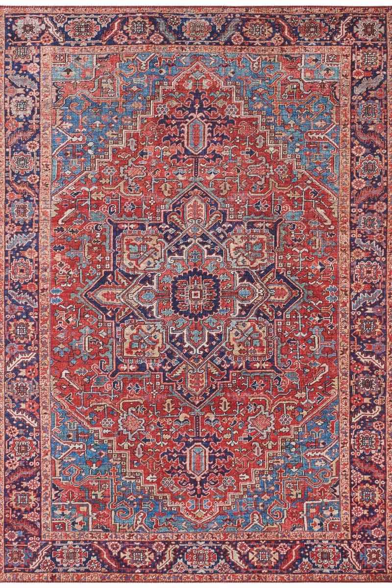 Amata Rug with intricate patterns in warm red and cool blue hues, perfect for enhancing any living space