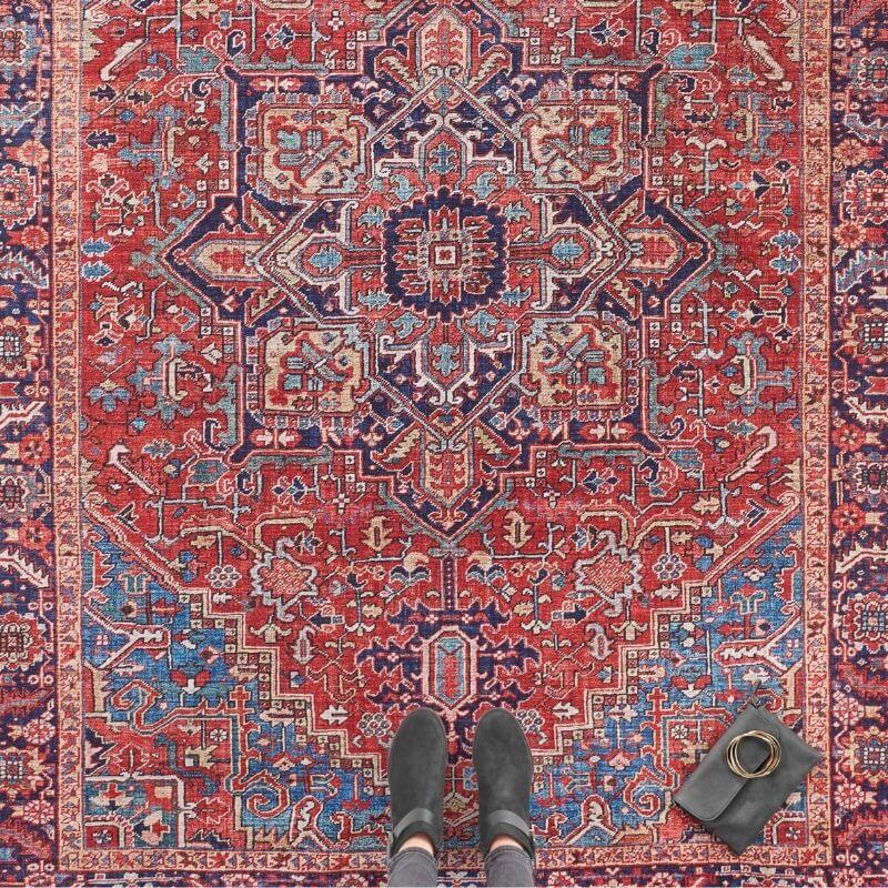 Amata Rug with intricate patterns in red and blue hues, perfect for enhancing any living space