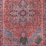 Amata Rug with intricate patterns in red and blue hues, perfect for enhancing any living space