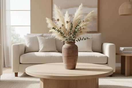 Amphora Vase on a wooden coffee table with dried flowers, enhancing a modern living room decor