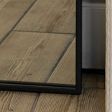 Elegant Jobu Home Arch Mirror with a sleek black frame on wooden flooring