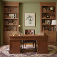 Elegant office featuring Artwork On Linen framed above a wooden desk with bookshelves and warm decor