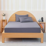SHEET STORY Fitted Sheet in grey on a wooden bed with matching pillows and minimalist decor