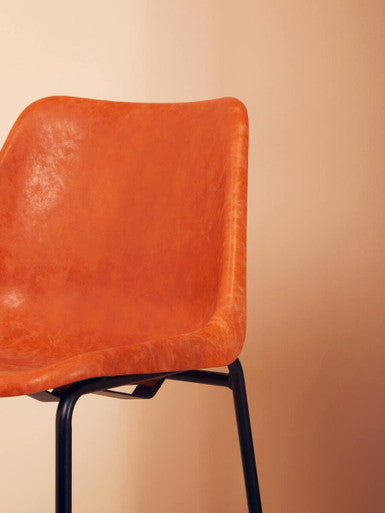 Orsina Bar Chair with a stylish orange leather seat and sleek black metal legs