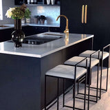 Stylish Nisu Home Bar Stool set at a modern kitchen island with a sleek design