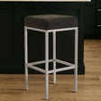 Orsina Bar Stool with a sleek silver frame and black cushioned seat for modern bar seating