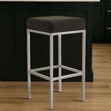 Orsina Bar Stool with a sleek silver frame and black cushioned seat for modern bar seating