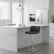 Orsina Bar Stool with a quilted black seat and chrome base in a modern kitchen setting
