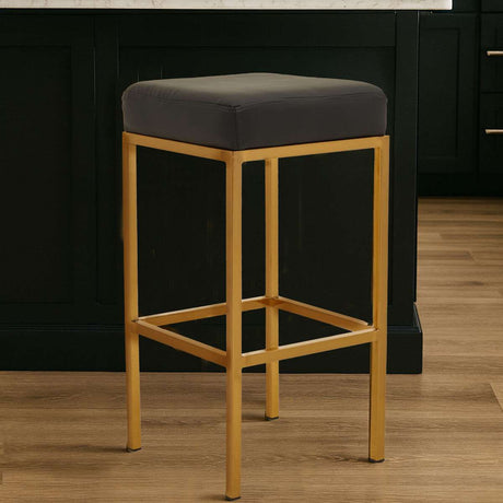Orsina Bar Stool with a sleek gold frame and comfortable grey seat, ideal for modern bar seating
