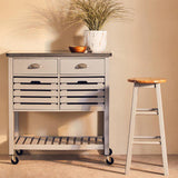 Orsina Bar Stool in natural wood finish, beside a stylish grey storage unit with drawers