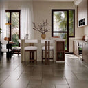 Stylish Nisu Home Bar Stool set in a modern kitchen with natural light and elegant decor