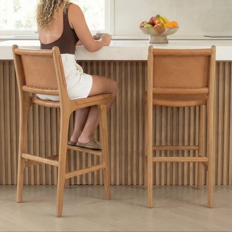 The Bali Concept Bar Stool in natural wood with leather seat, ideal for modern kitchens