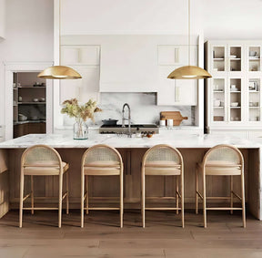 Nisu Home Bar Stool with a wooden frame and soft upholstered seat in a stylish kitchen setting